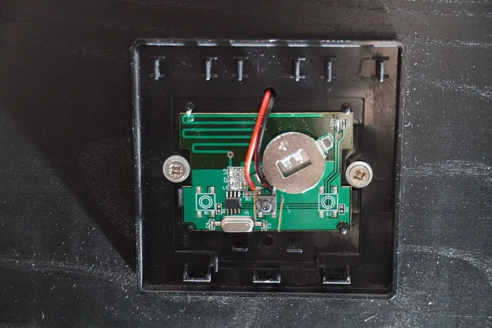Hacked button with wires soldered to PCB