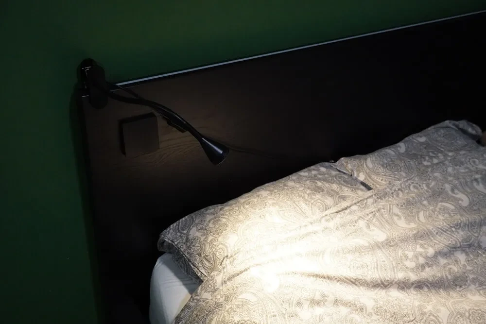 Addition of an IKEA clip lamp on the headboard
